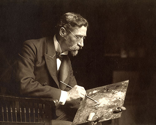 Sepia-toned photo of T.C. Steele holding palette